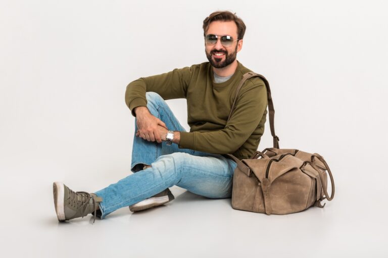 hansome bearded stylish man sitting on floor u8c62kr